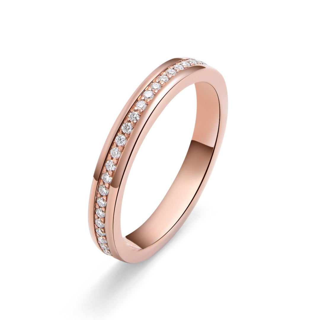 Top-down view of 14k rose gold eternity band highlighting micro-set diamonds