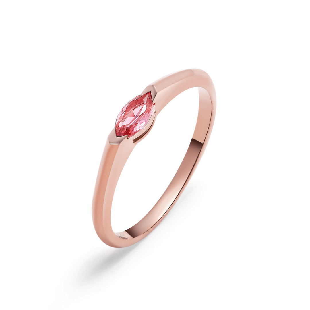 Top-down view of rose gold marquise-cut diamond ring highlighting precise prong setting