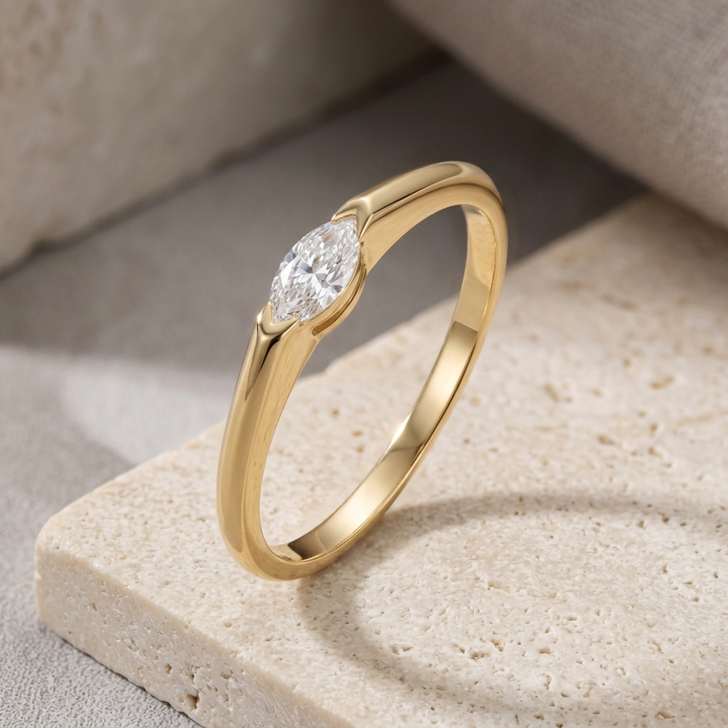 Gold ring with a diamond on a textured stone surface